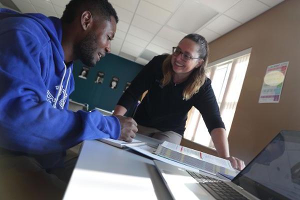 Student and instructor at study table